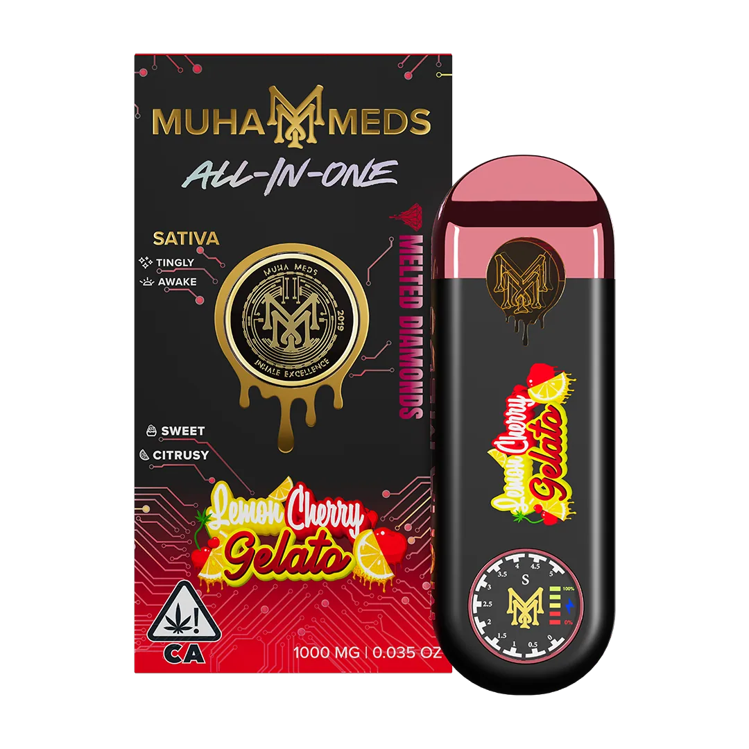 A Muha Meds all-in-one device photographed on a dark surface beside its packaging.