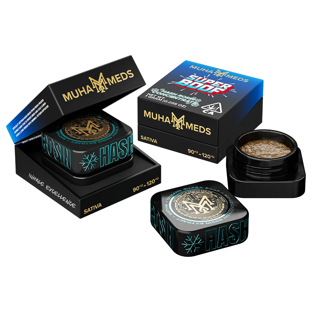 Muha Meds hash rosin concentrate: an open jar of golden rosin with its lid and outer packaging alongside.